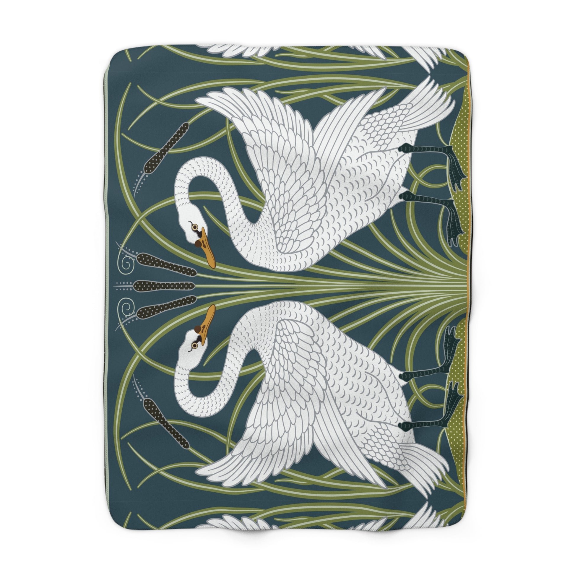 A Sherpa fleece blanket with a floral and swan William Morris & Co pattern in white and green colours on a dark background.