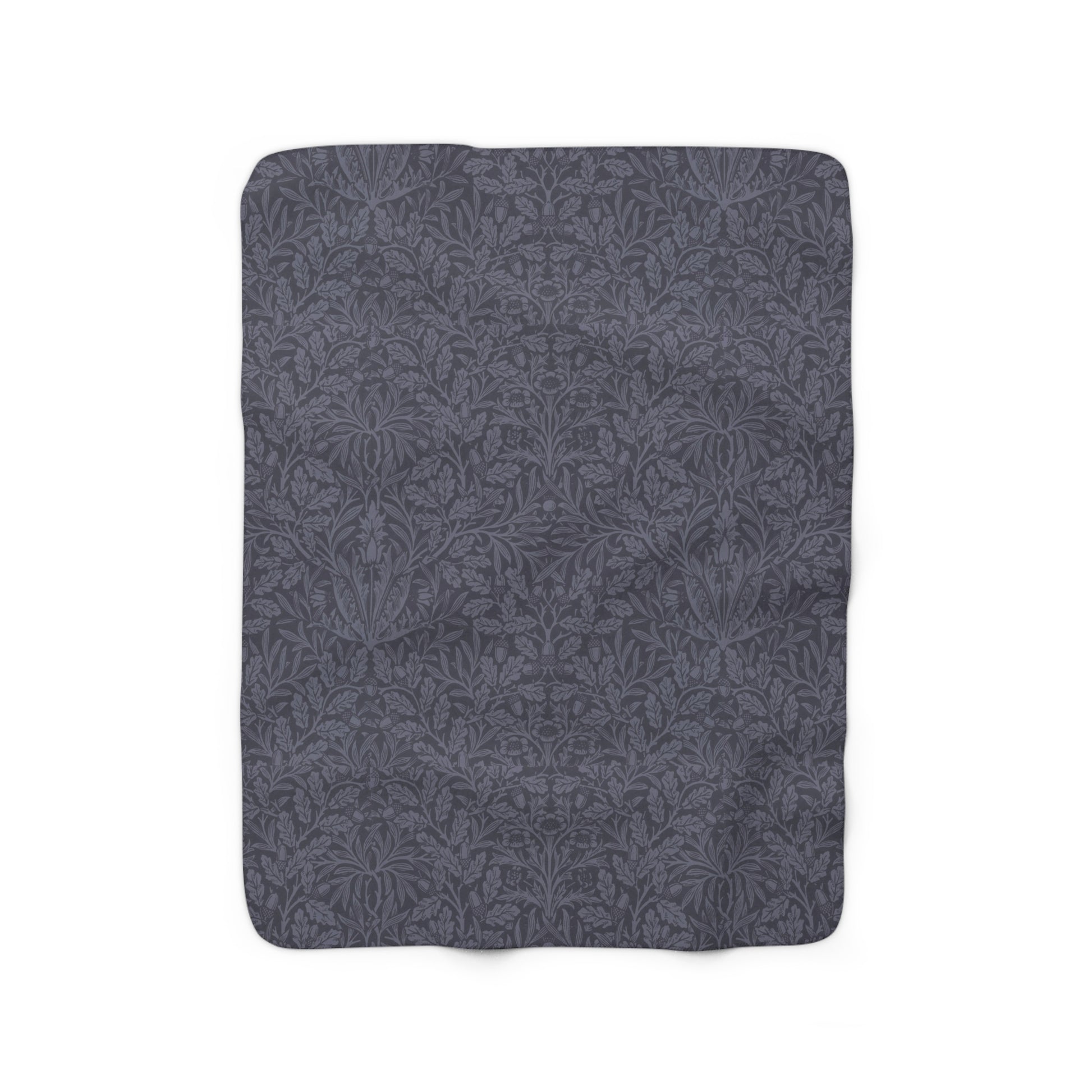 A smoky blue Sherpa fleece blanket with a floral pattern, made inspired by William Morris' Acorn and Oak Leaves collection.