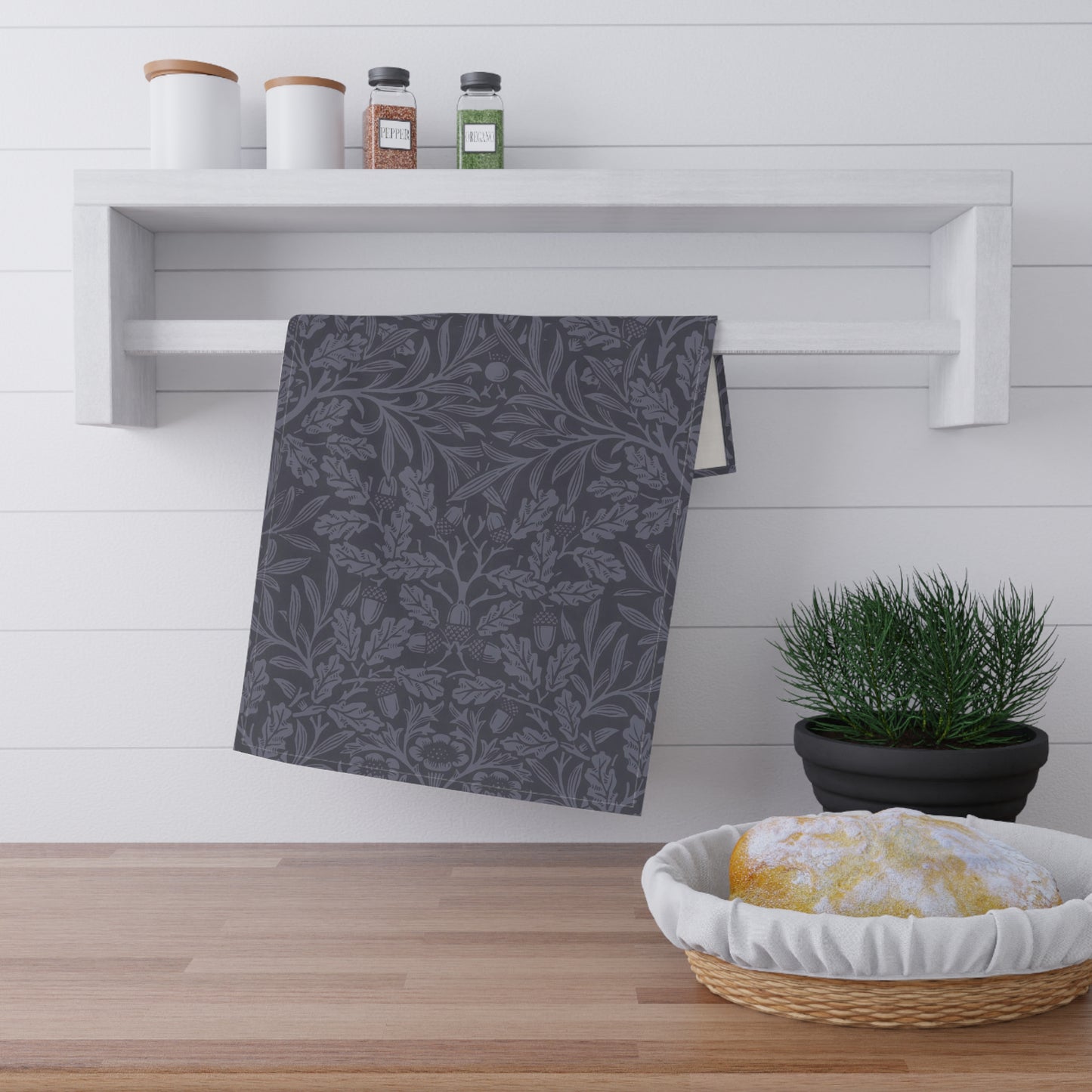 A smoky blue kitchen tea towel with a floral and leaf pattern inspired by William Morris - Acorn and Oak Leaves Collection.