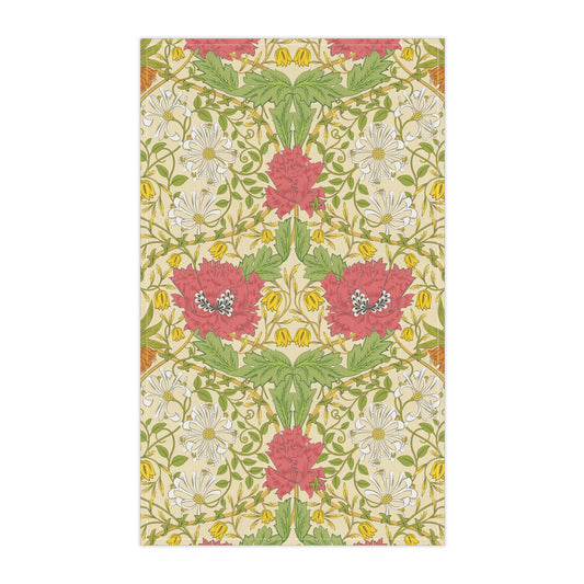 A kitchen tea towel with a floral pattern inspired by William Morris, featuring honeysuckle designs in red, yellow, and green on a light background.