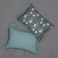 A rectangular lumbar cushion with a William Morris & Co floral pattern in shades of blue, beige, and white, featuring a concealed beige zipper.