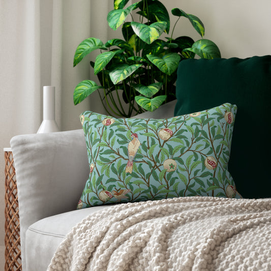 A rectangular lumbar cushion with a William Morris & Co bird and pomegranate print on a tiffany blue background, featuring a concealed zipper.