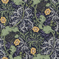 Rectangular lumbar cushion with a floral William Morris & Co pattern in yellow, green, and other colours on a dark background.