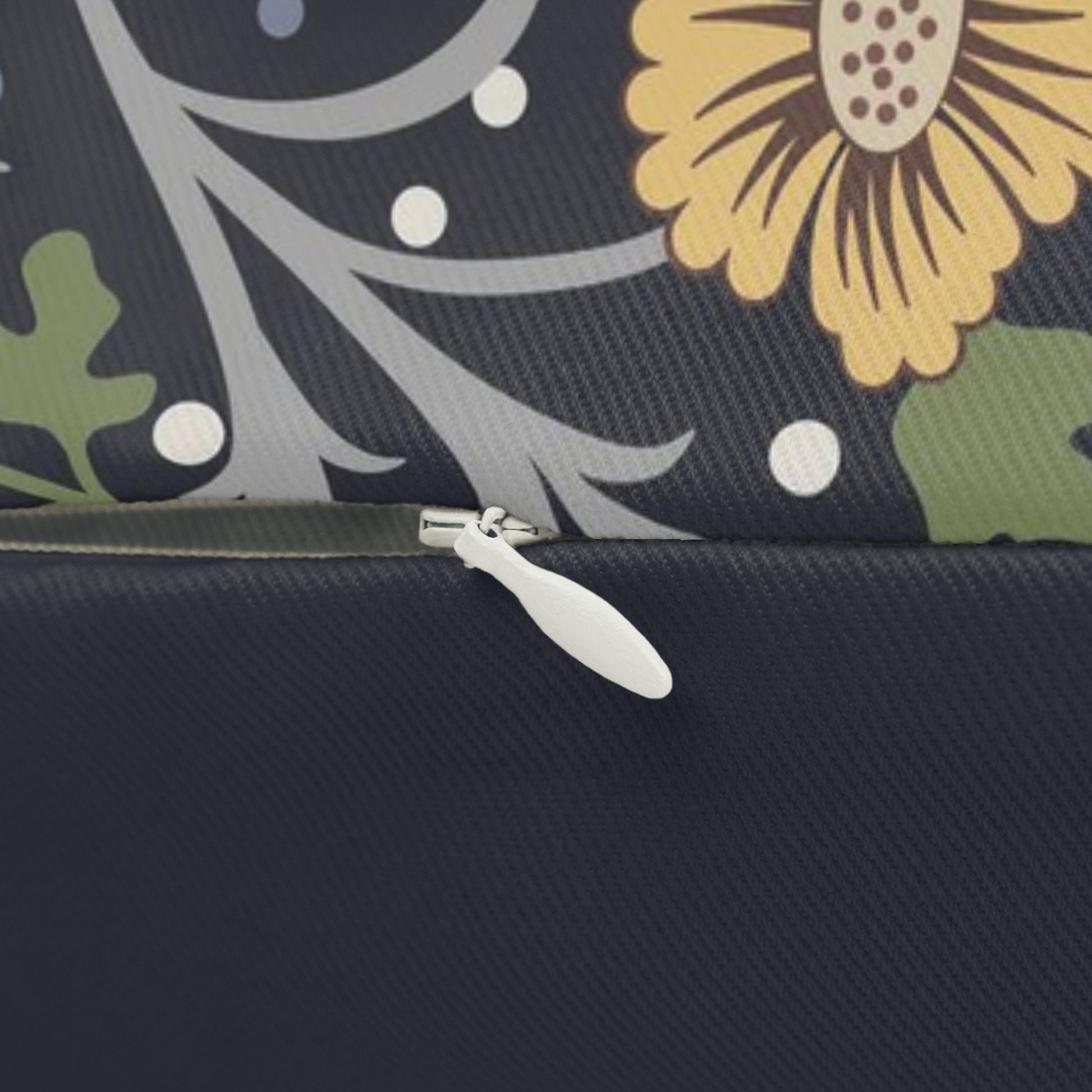 Rectangular lumbar cushion with a floral William Morris & Co pattern in yellow, green, and other colours on a dark background.