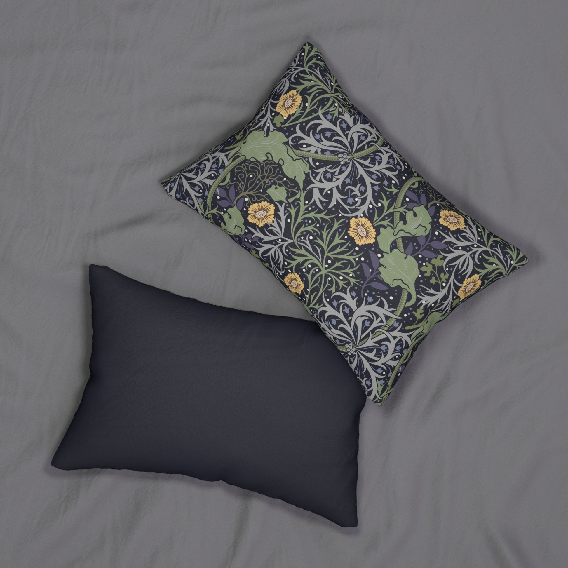 Rectangular lumbar cushion with a floral William Morris & Co pattern in yellow, green, and other colours on a dark background.