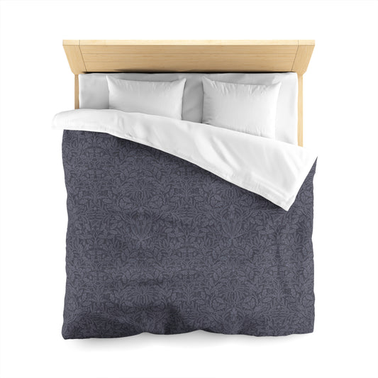 Gray patterned duvet cover with white pillows on a wooden bed frame against a white background