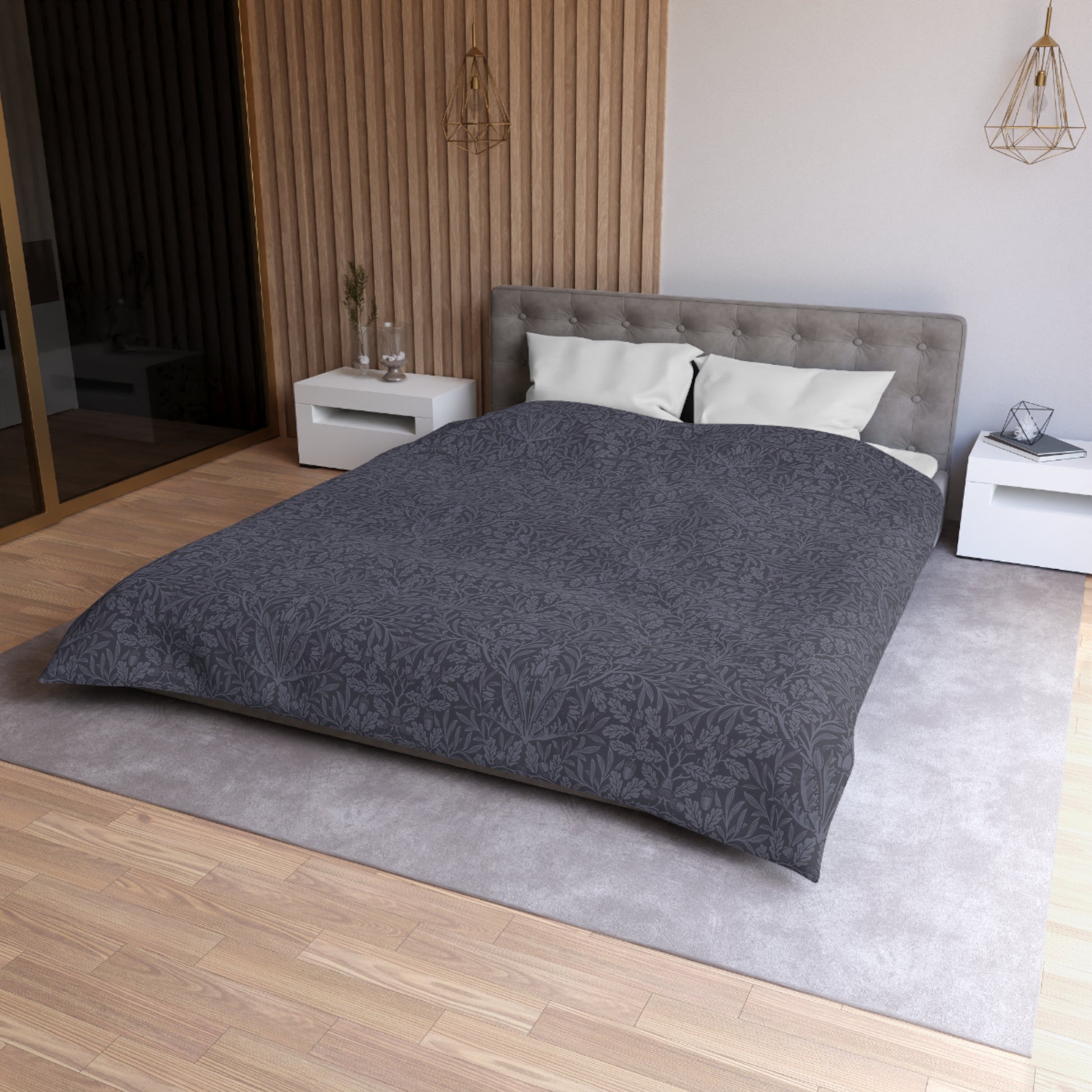 Bedroom with a bed featuring gray bedding and white pillows.