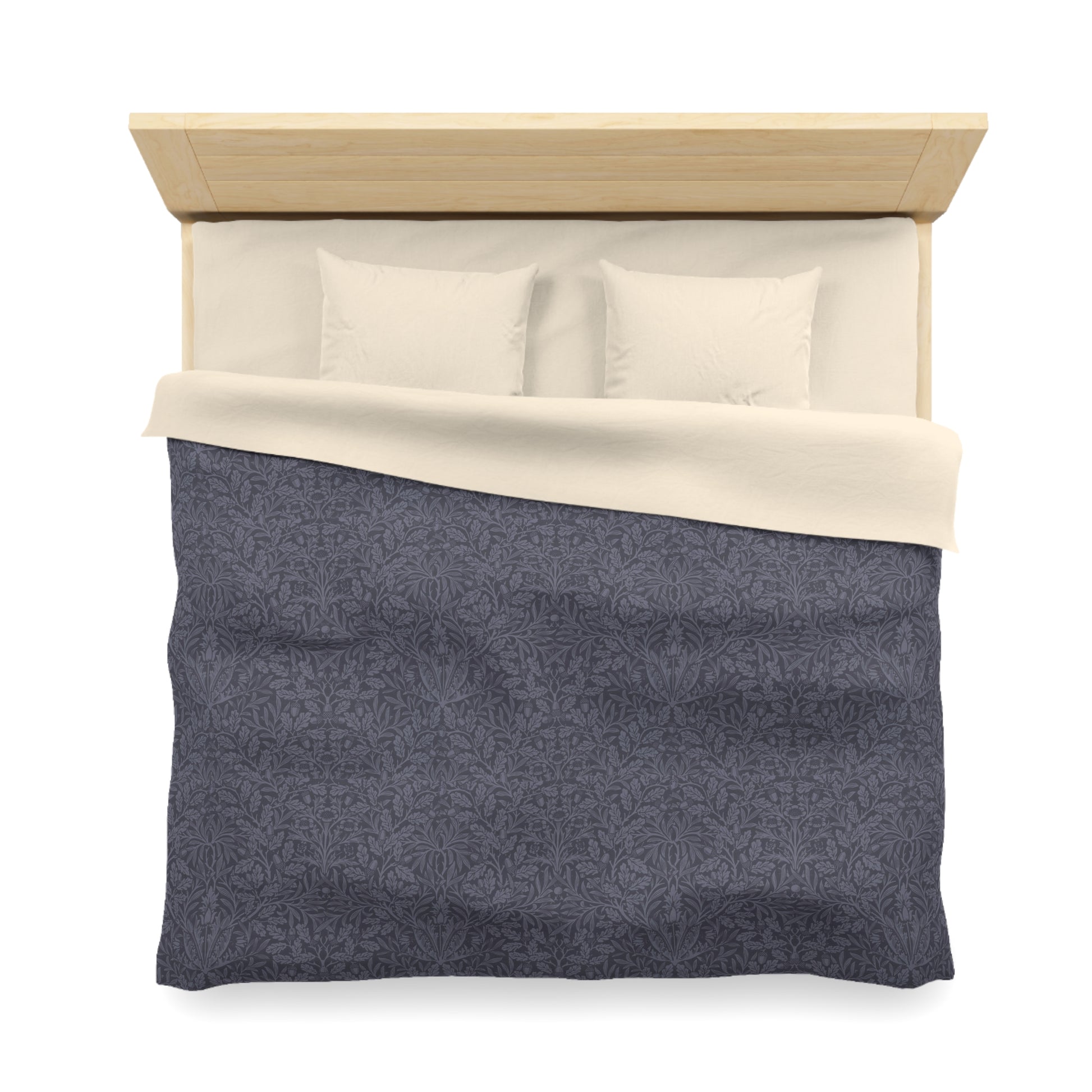 Bed with gray comforter and white pillows on a white background