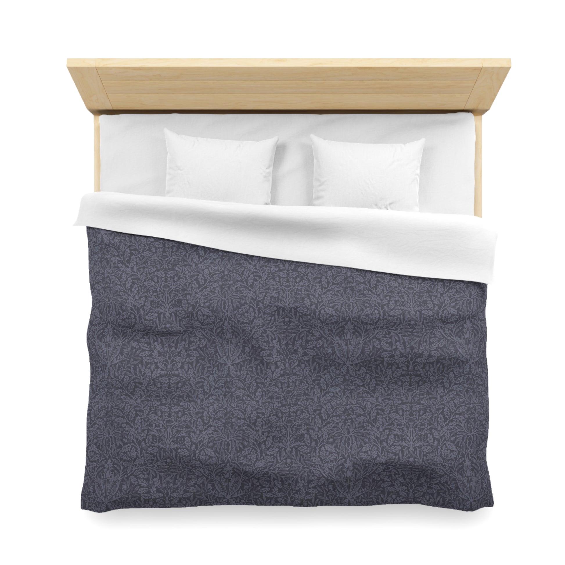 Bed with gray comforter and white pillows on a white background