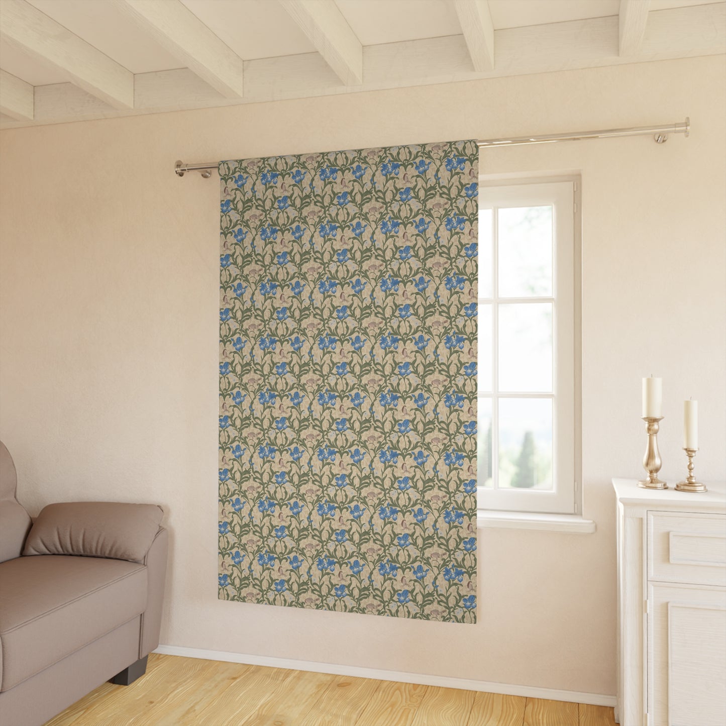 Floral patterned curtain hanging in a room with a sofa and window.