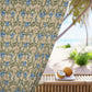 Floral-patterned curtain with a beach view outside