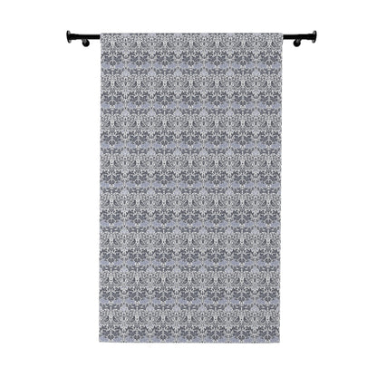 Decorative curtain with a subtle pattern on a white background