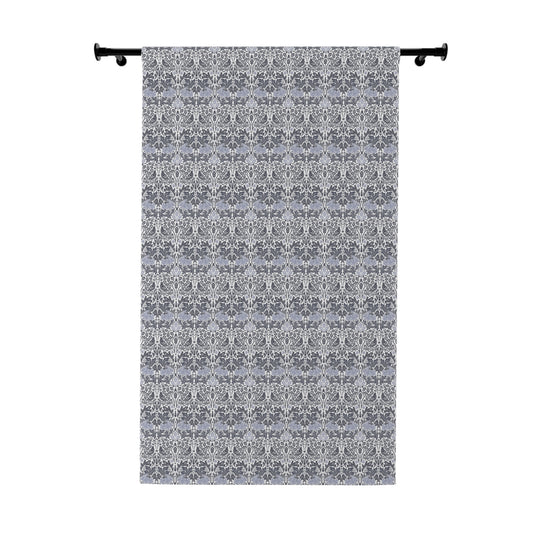 Decorative curtain with a subtle pattern on a white background