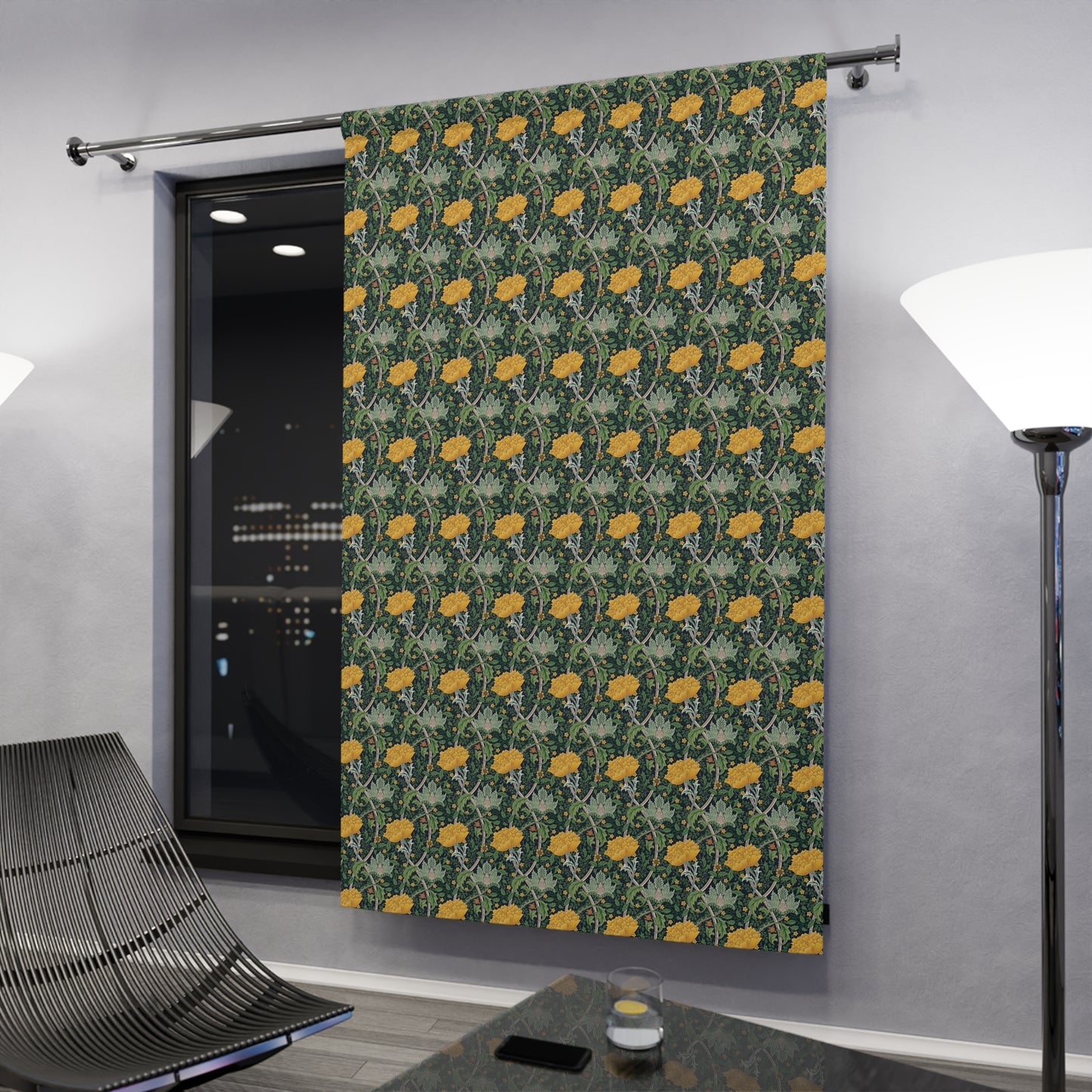 Patterned curtain with yellow flowers on a gray wall