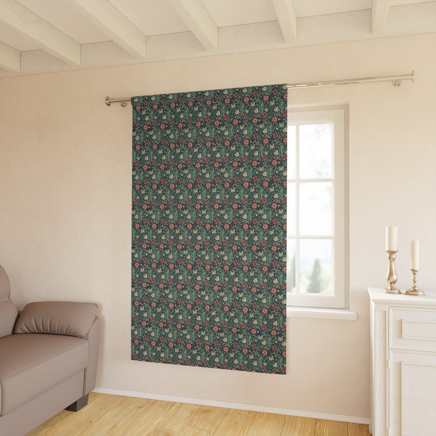 Floral patterned curtain hanging in a room with a sofa and window.