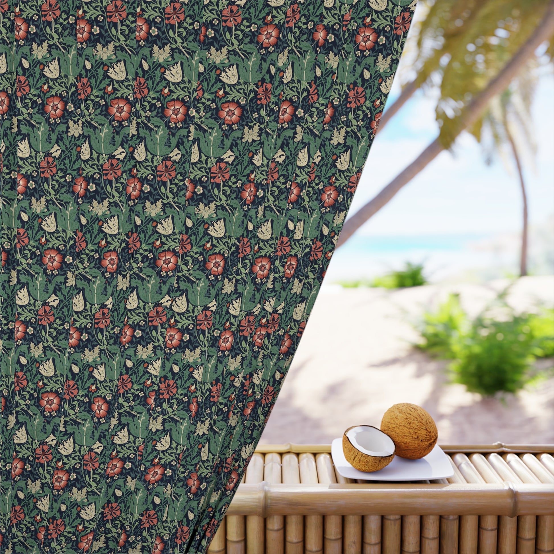 Floral patterned curtain with a beach view in the background
