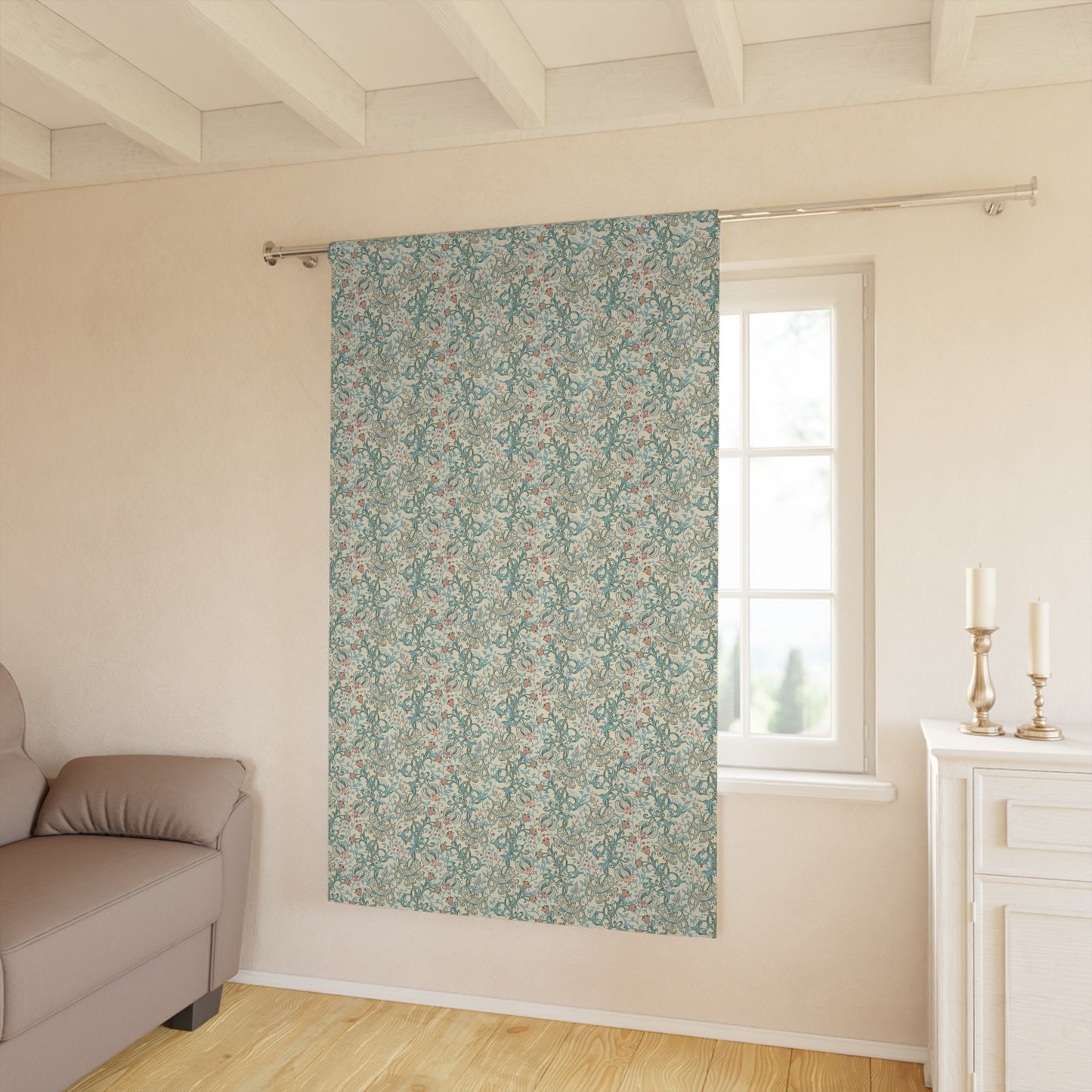 Floral patterned roller blind in a room with a sofa and window.