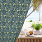 Floral patterned fabric with a beach scene featuring coconuts on a table.