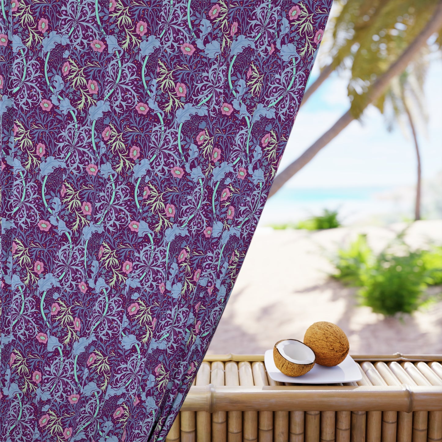 Floral patterned fabric draped over a chair with a beach setting in the background