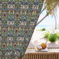 Decorative outdoor curtain with a colorful pattern next to a table with coconuts on a patio.