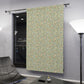 Patterned sliding door in a modern interior setting with a chair and lamp.