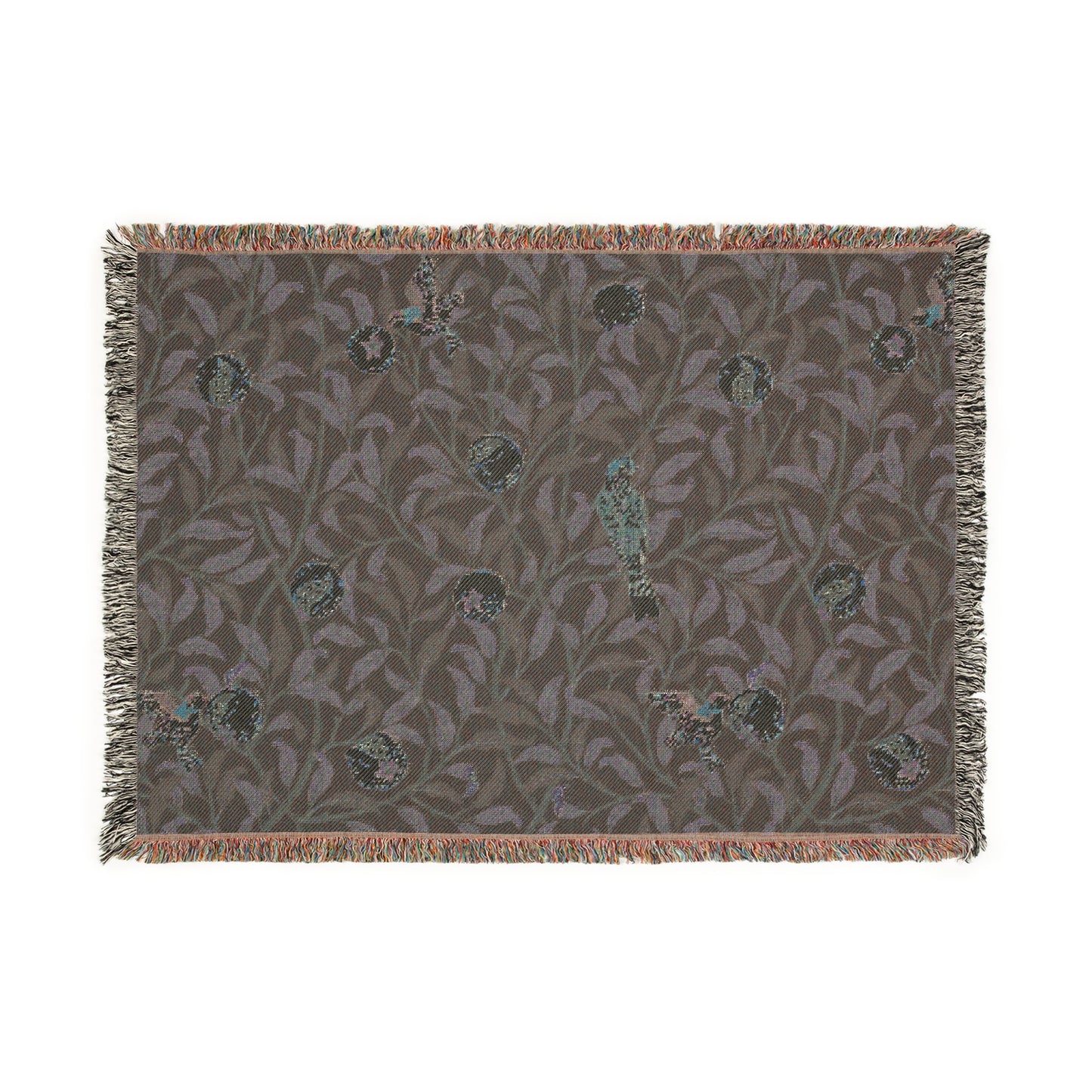 A woven cotton blanket with a geometric William Morris & Co pattern featuring birds and pomegranates in a onyx black colour, with fringed edges.