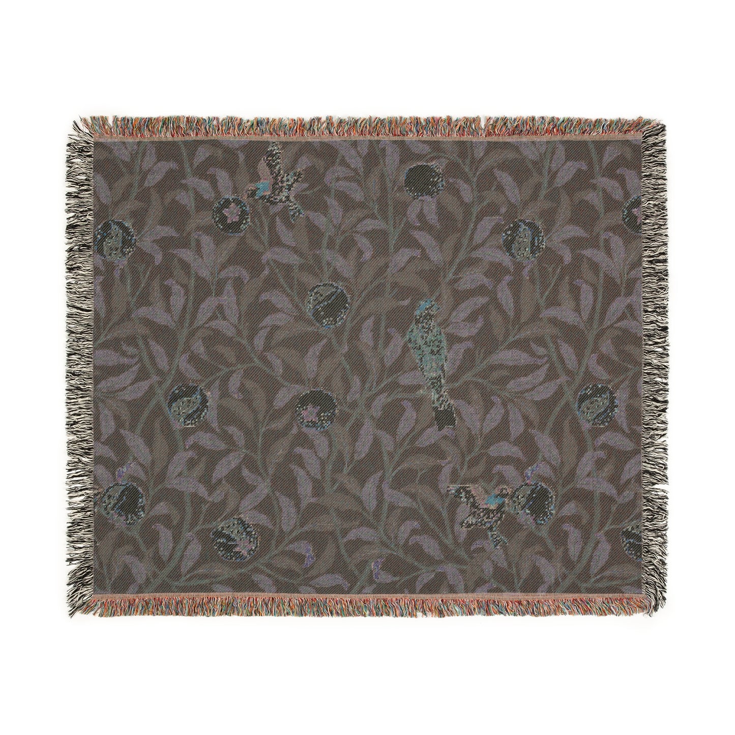 A woven cotton blanket with a geometric William Morris & Co pattern featuring birds and pomegranates in a onyx black colour, with fringed edges.