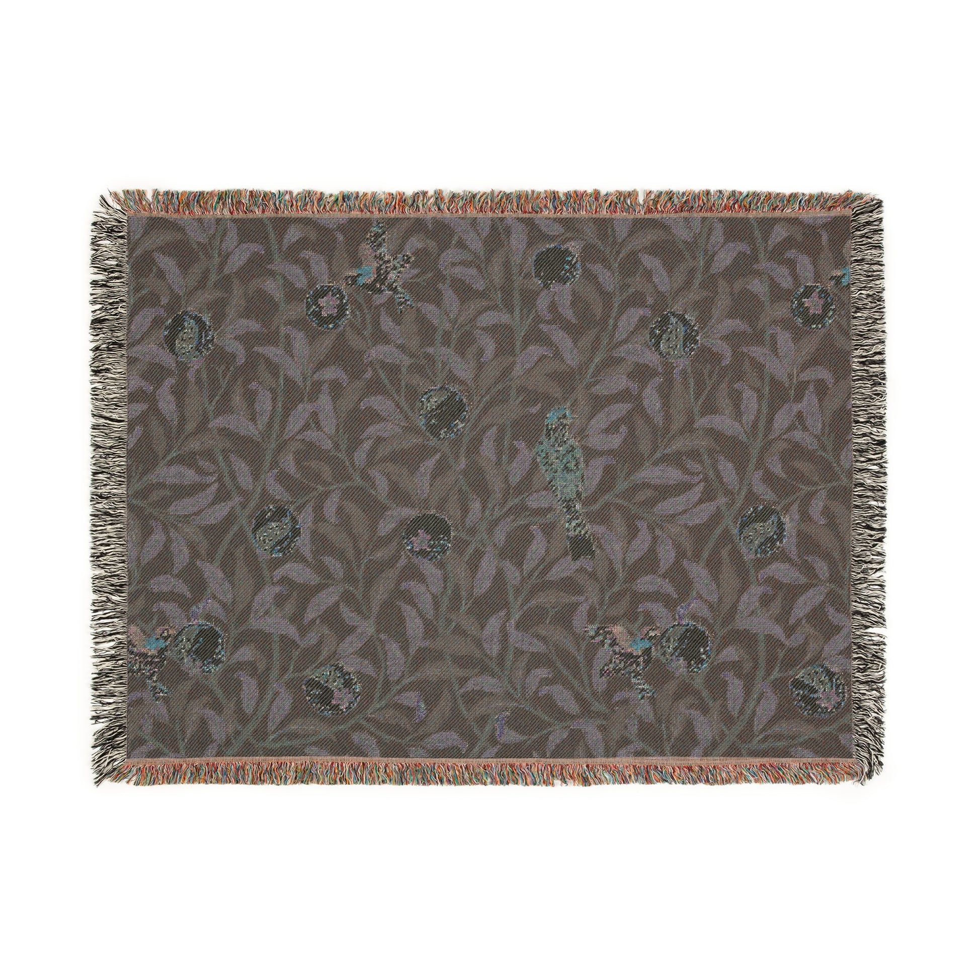 A woven cotton blanket with a geometric William Morris & Co pattern featuring birds and pomegranates in a onyx black colour, with fringed edges.