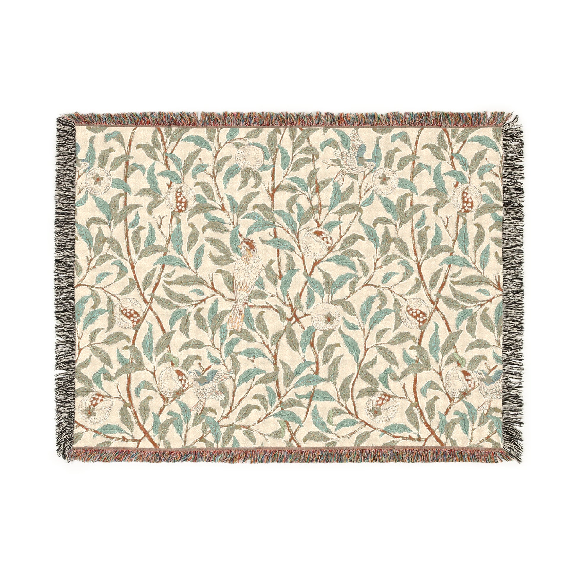 A woven cotton blanket with a geometric bird and pomegranate pattern in beige, green, and brown colors, with fringed edges.
