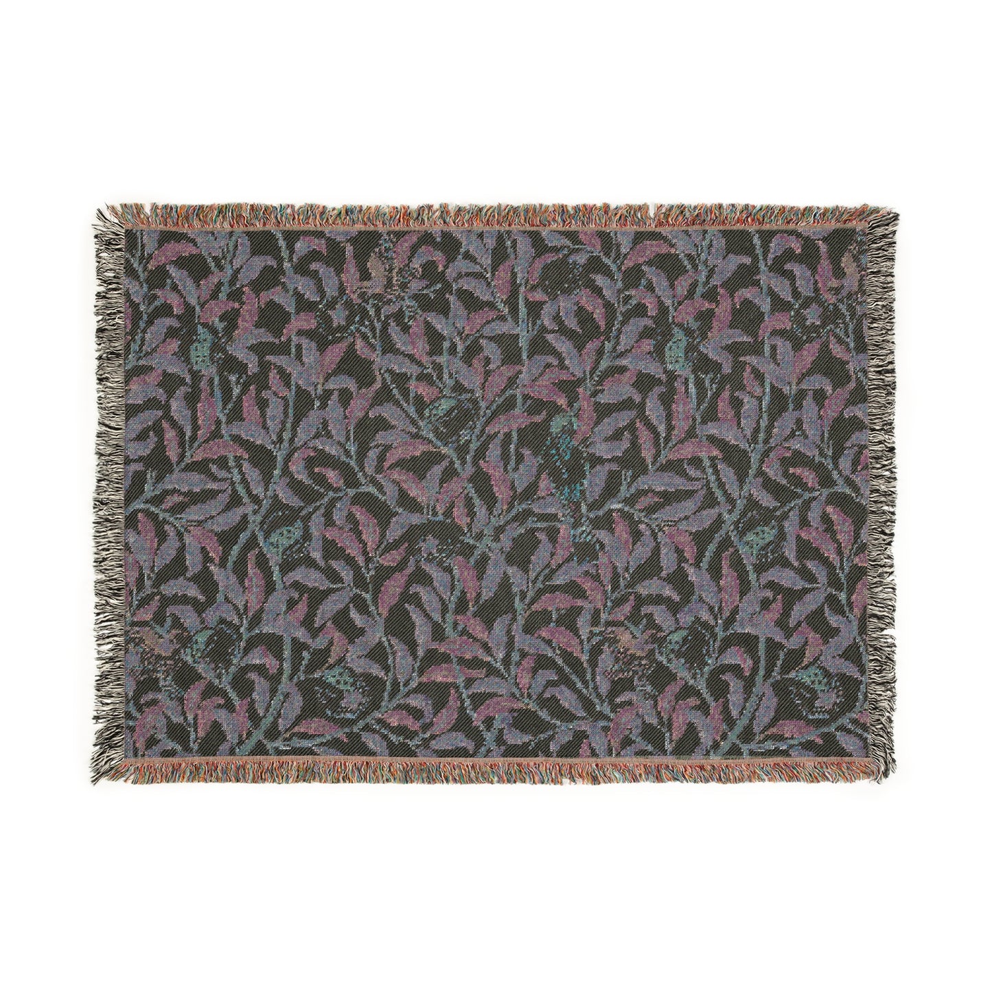 A woven cotton blanket with a geometric bird and pomegranate William Morris & Co pattern in beige, green, and brown colours, with fringed edges.