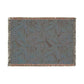 Textured throw blanket with a pattern on a white background