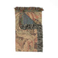 Decorative throw blanket with intricate patterns and fringes on a white background