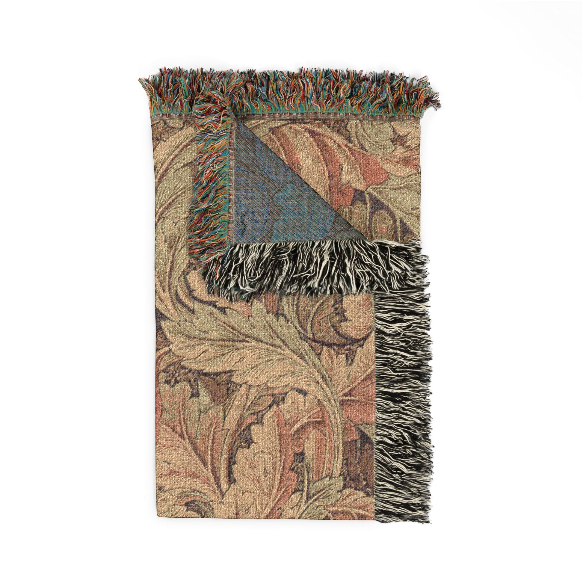 Decorative throw blanket with intricate patterns and fringes on a white background