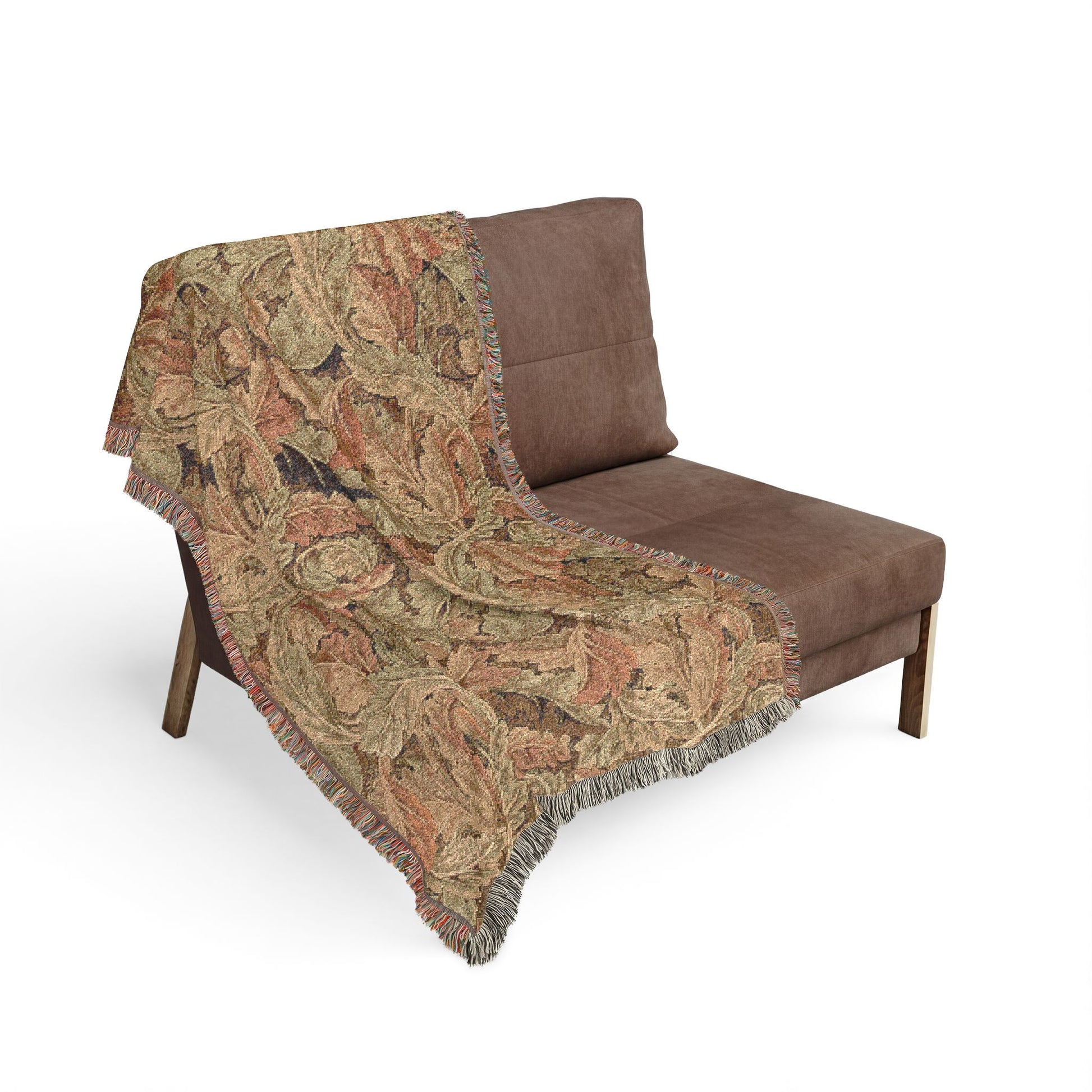 Brown sofa with a patterned blanket draped over it on a white background