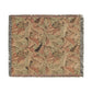 Woven blanket with leaf pattern on a white background