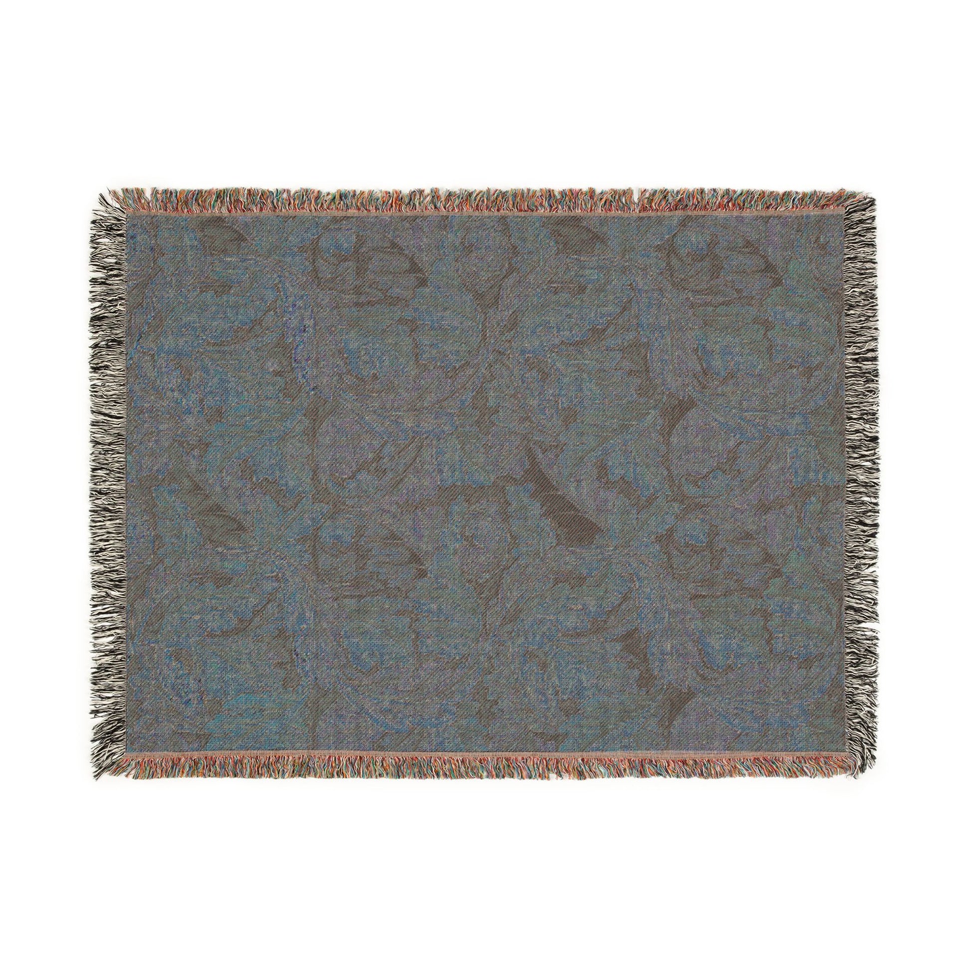 Floral patterned throw blanket with fringe on a white background