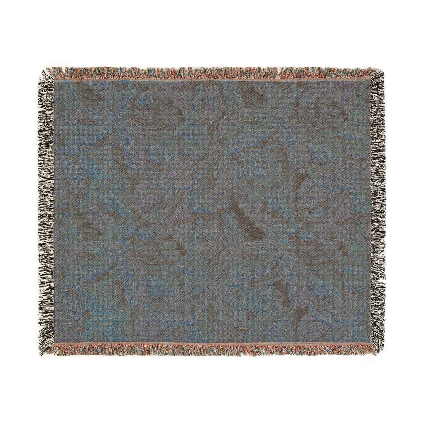 Patterned throw blanket with fringe on a white background