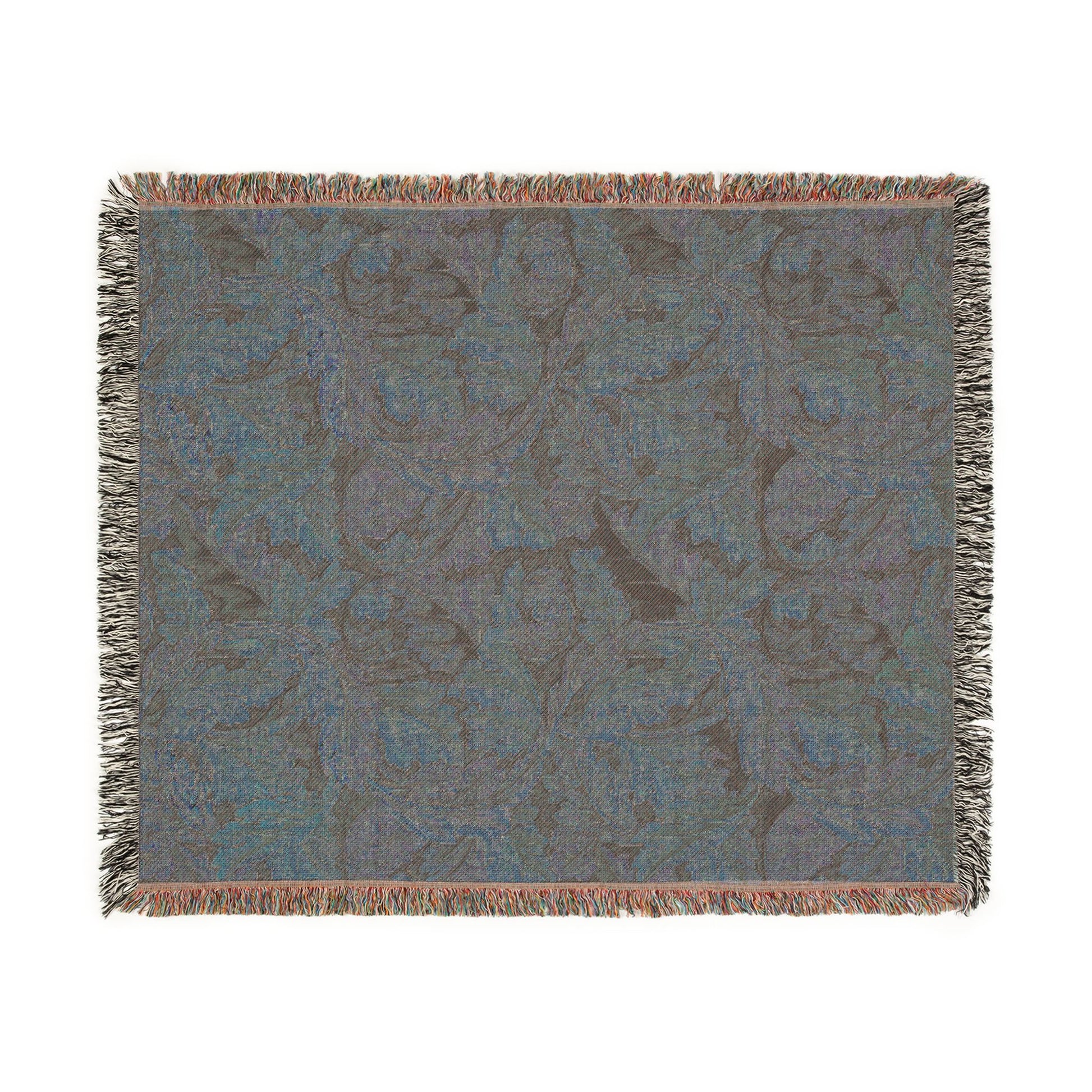 Patterned throw blanket with fringe on a white background