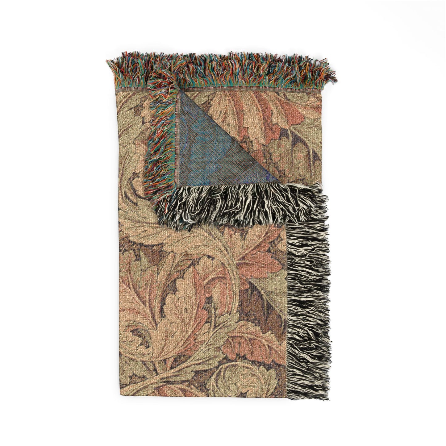 Decorative woven blanket with floral patterns and fringed edges on a white background
