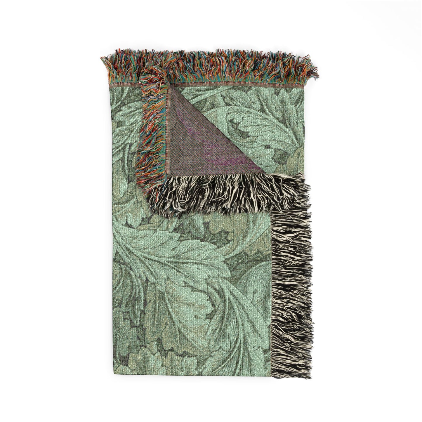 Decorative throw blanket with floral pattern and fringed edges on a white background