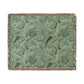 Green floral patterned throw blanket with fringe on a white background