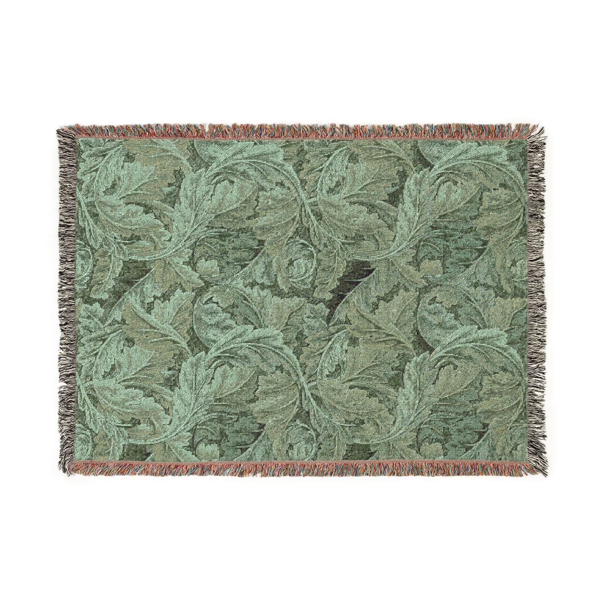 Green woven blanket with leaf pattern on a white background