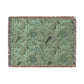 Green patterned throw blanket with fringe on a white background