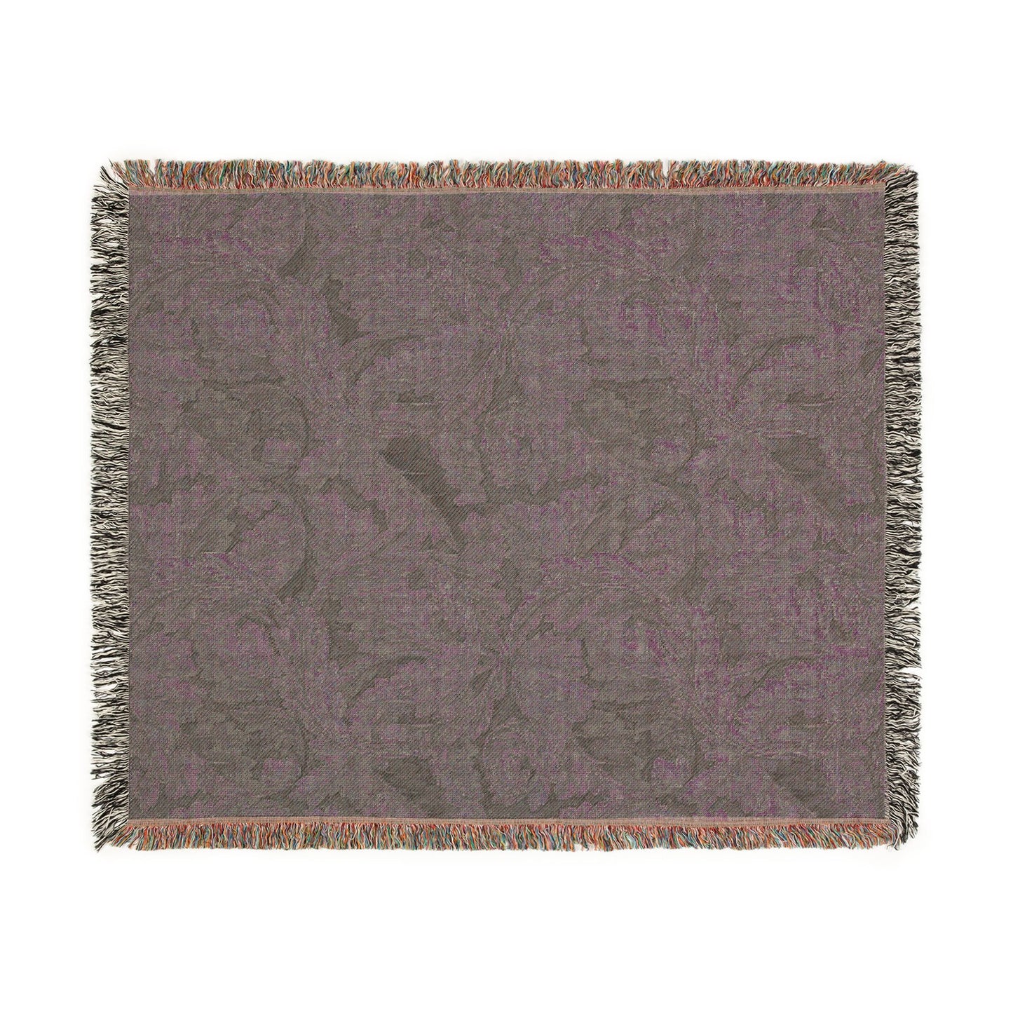 Floral patterned throw blanket with fringe on a white background