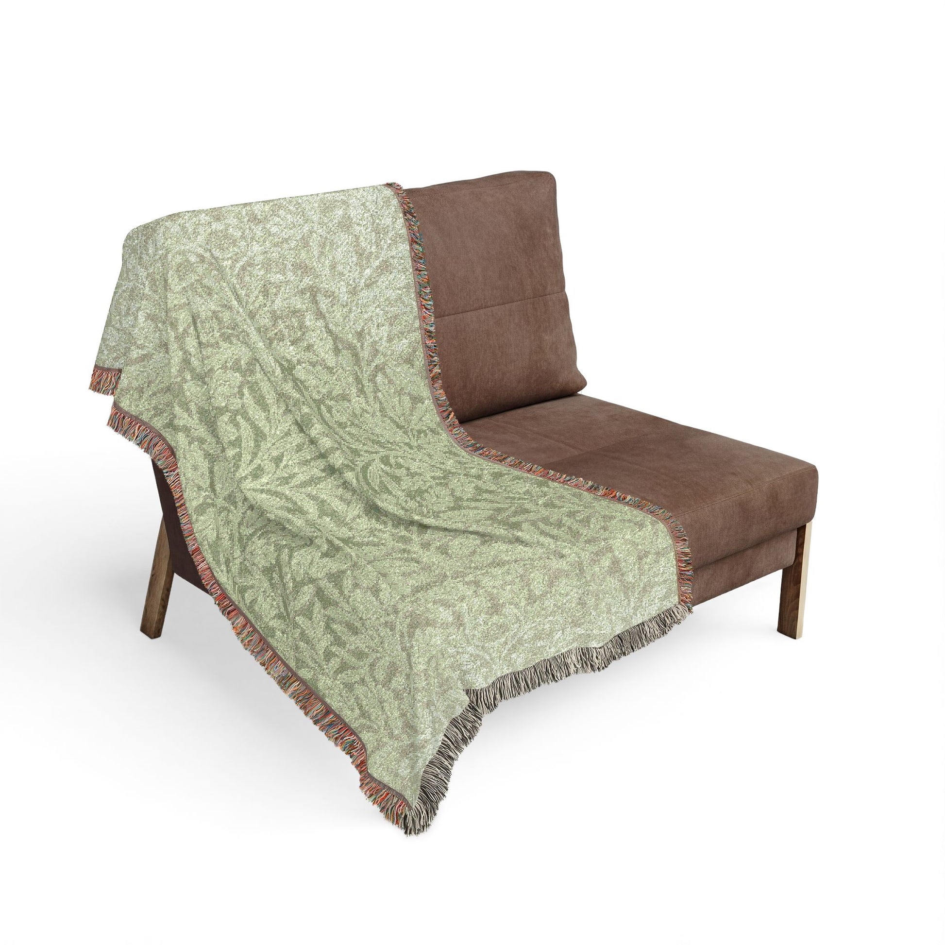 Gray blanket with turtle pattern draped over a brown chair on a white background