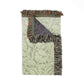 Floral-patterned rug with fringe on a white background