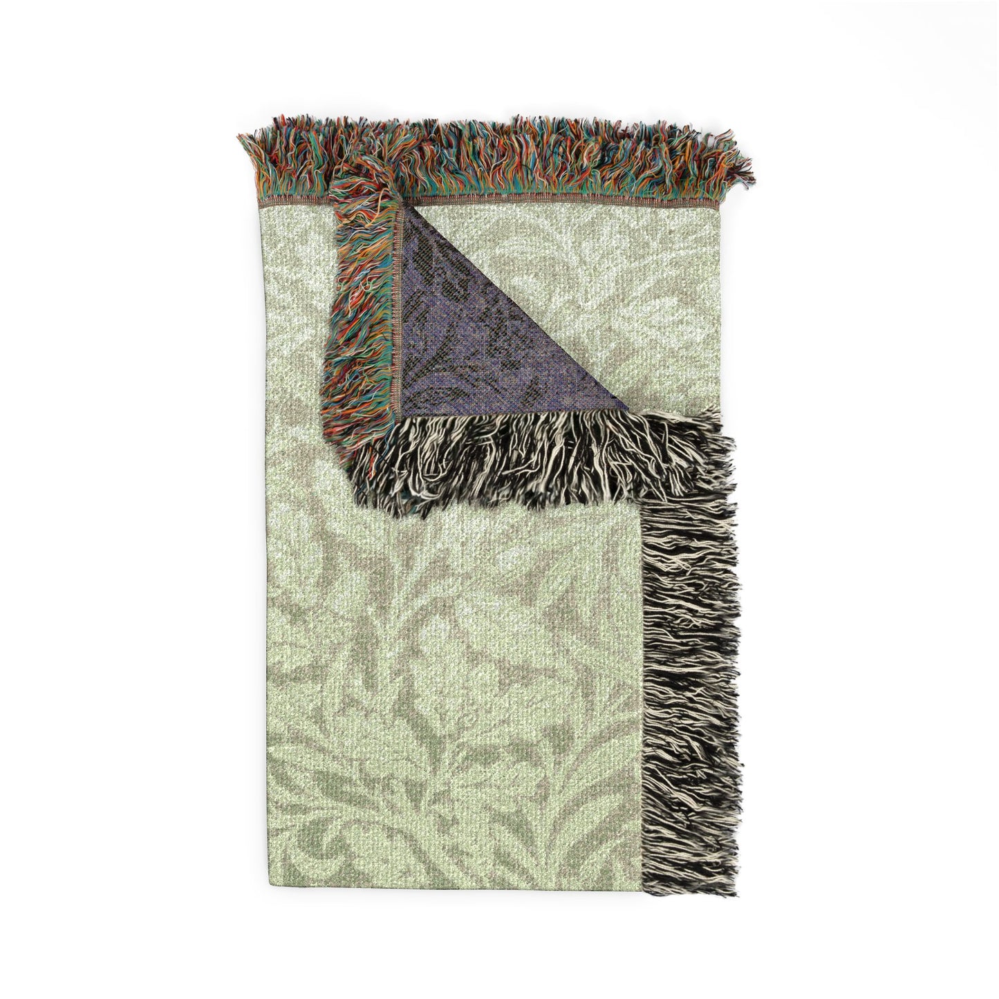Floral-patterned rug with fringe on a white background