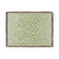 Woven blanket with a leaf pattern on a white background