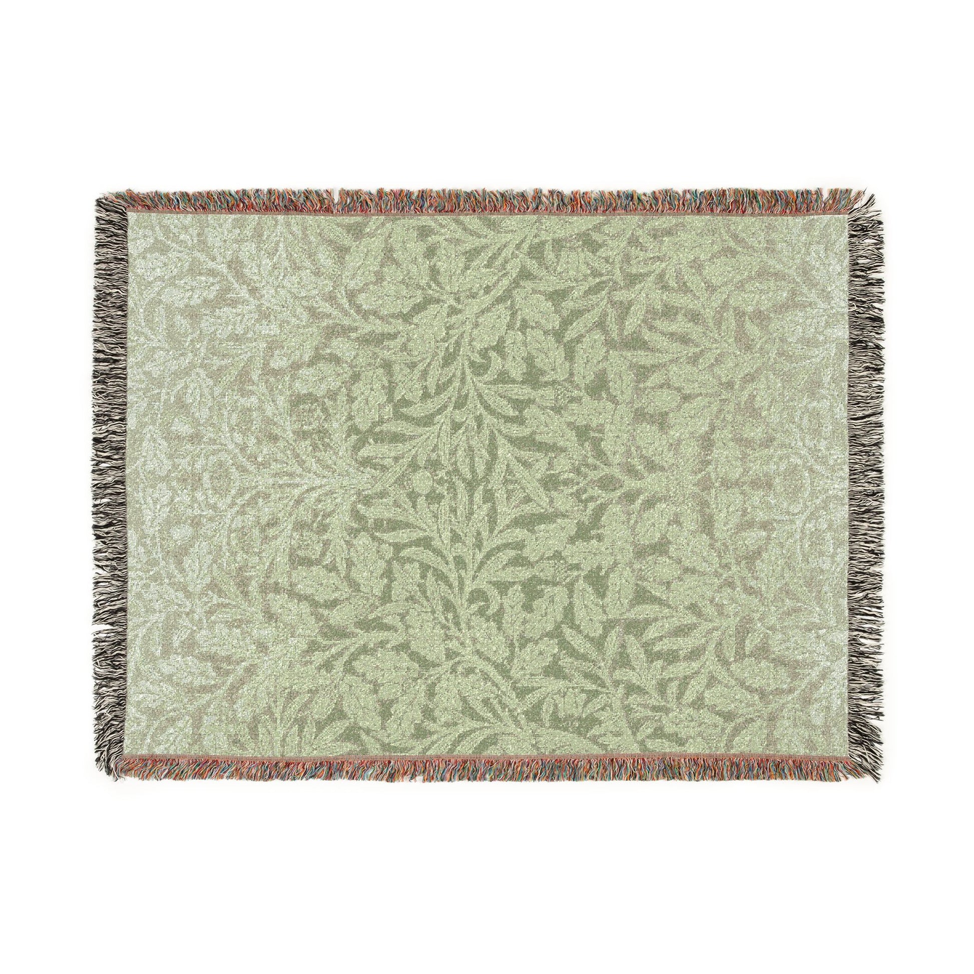 Woven blanket with a leaf pattern on a white background