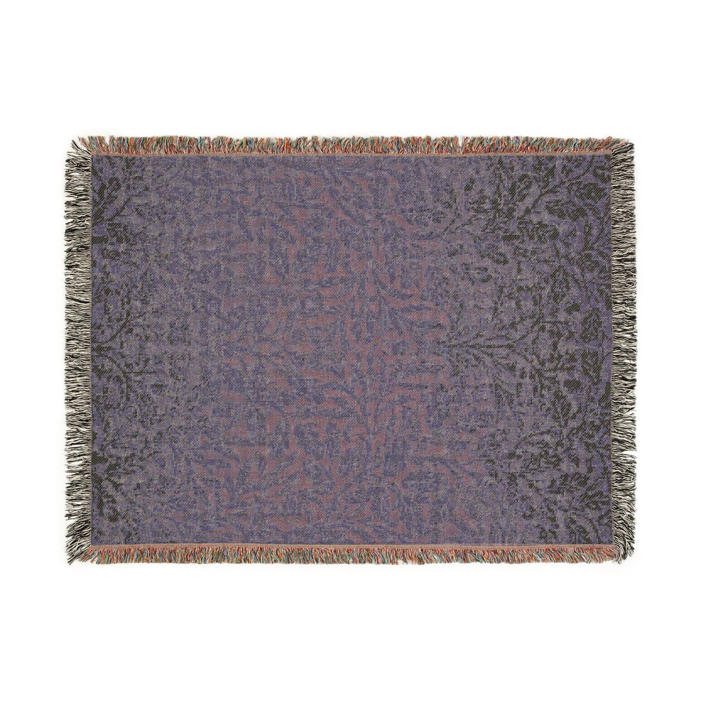 Patterned throw blanket with fringe on a white background